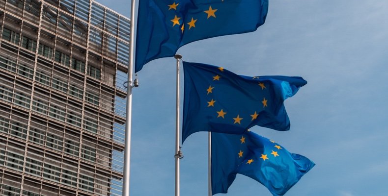 European Union flags against the European parliament building